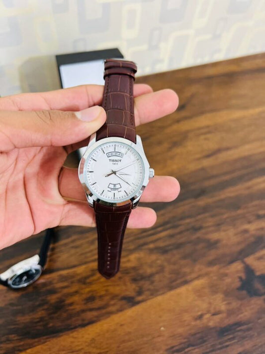 Swiss-Made Tissot Leather Watch with Full Day-Date Display, 100M Water Resistance, and 1-Year Free Warranty